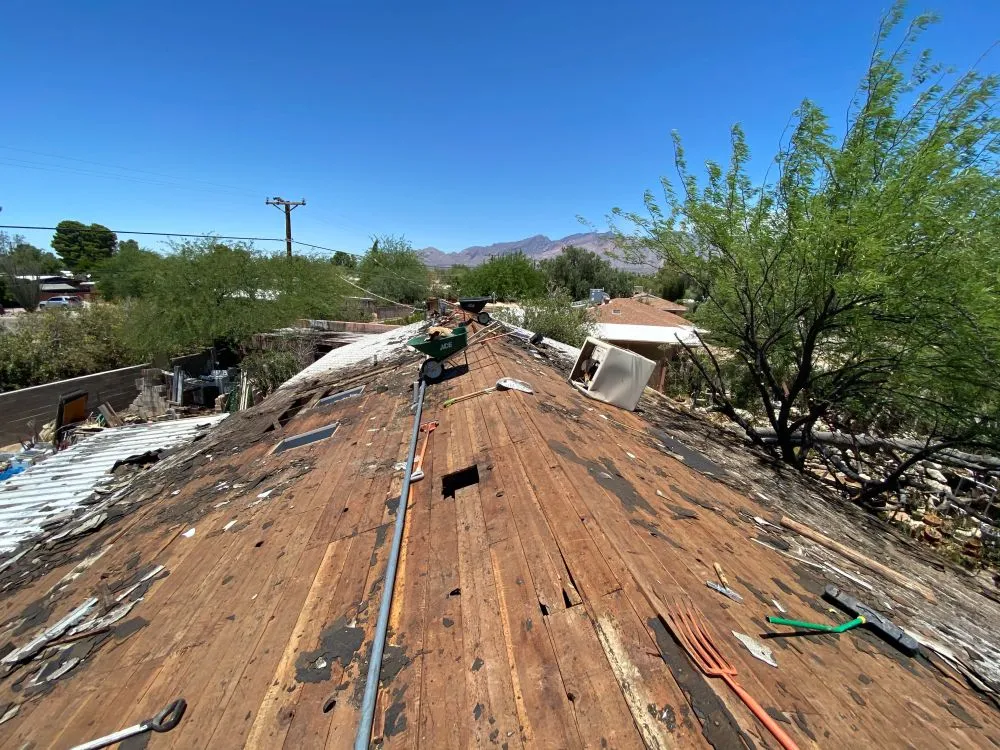 Exposed roof deck mid-tearoff during a roof replacement project in Tucson, AZ