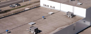 roofing contractor Tucson commercial building rooftop with AC units in Tucson, AZ by DC Roofing